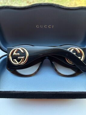 Gucci brown sunglasses with double Gucci emblem on the side made in italy